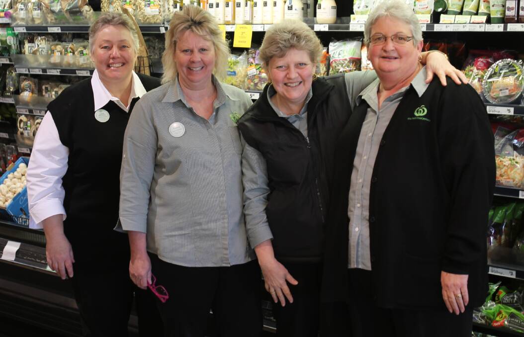 LONG SERVICE: Leisa McGaun, Brenda Chapman, Tracey Finucance and Jeannie Deece have thoroughly enjoyed the last 30 years working with one another at the Cootamundra Woolworths. The store is indebted to them. 
