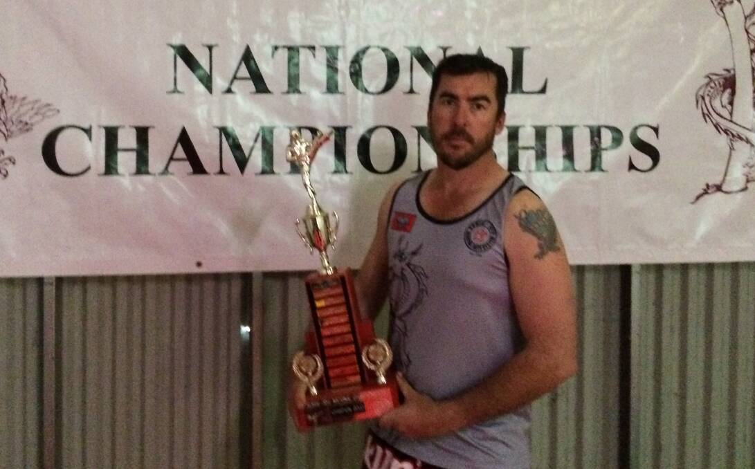 PREPARED: Sensei Andrew Finch of the Cootamundra Kumiai-Ryu dojo with the team trophy that will be awarded to the dojo with the most successful students at the national championships to be held in Cootamundra in October.  