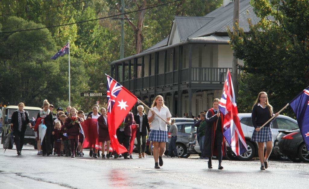 The rain held off long enough for Jugiong residents to commemorate Anzac day with a traditional march. Photo: Anne Ford