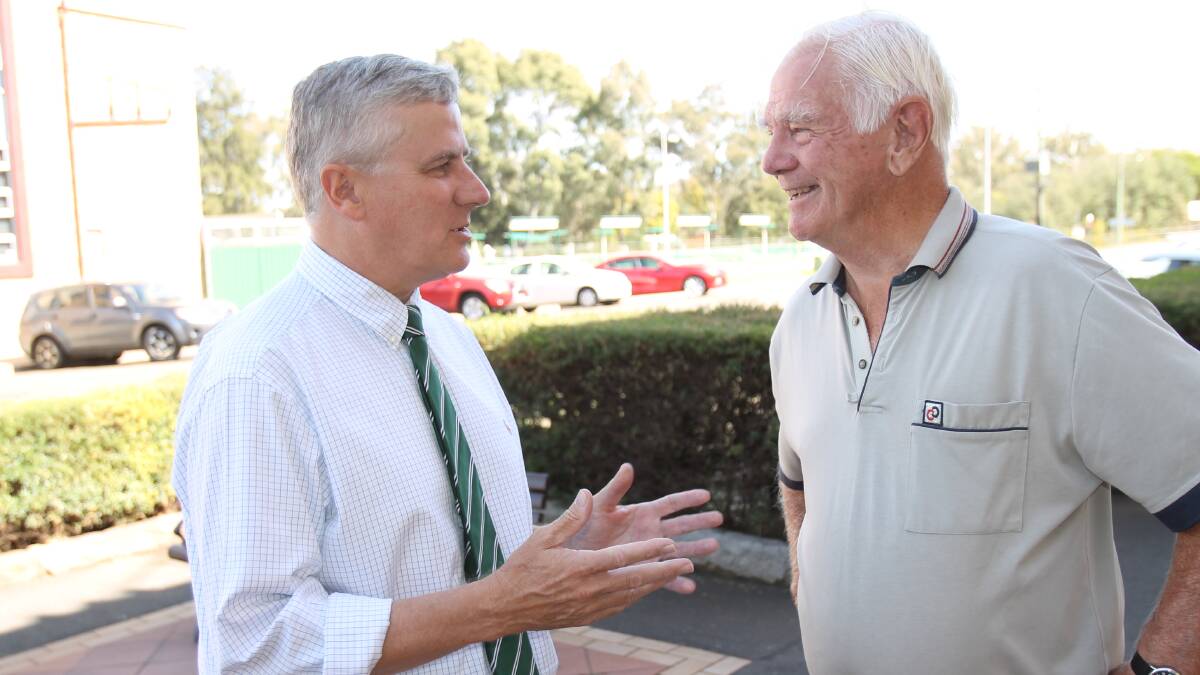 MEETING THE LOCALS: Riverina MP Michael McCormack stops to chat with Mike Forster during a visit to Cootamundra. Picture: Harrison Vesey