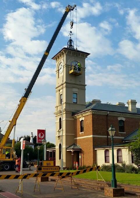 CHIME TIME: Long-awaited work on the town clock began last weekend with the removal of the mechanism. Picture: Cootamundra Development Corporation