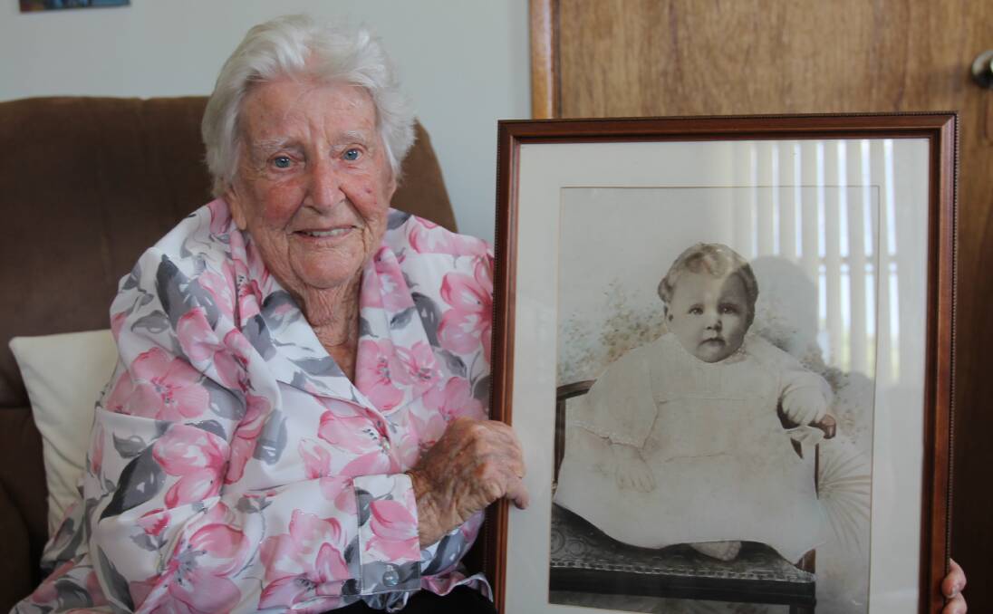 CENTENARIAN: Doreen Gunn, pictured here with a photo of herself at six months old, celebrates her 104th birthday on Monday February 29. Picture: Harrison Vesey