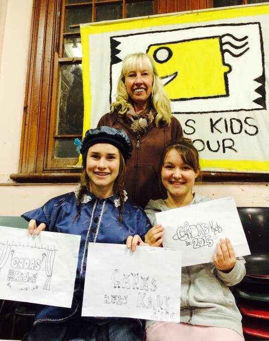 Jo Chester, Sarah Stephens and Brianna Hefren display some of the great designs for the 2015 CADAS Kids shirt. Brianna is holding her winning design. Picture: Harrison Vesey