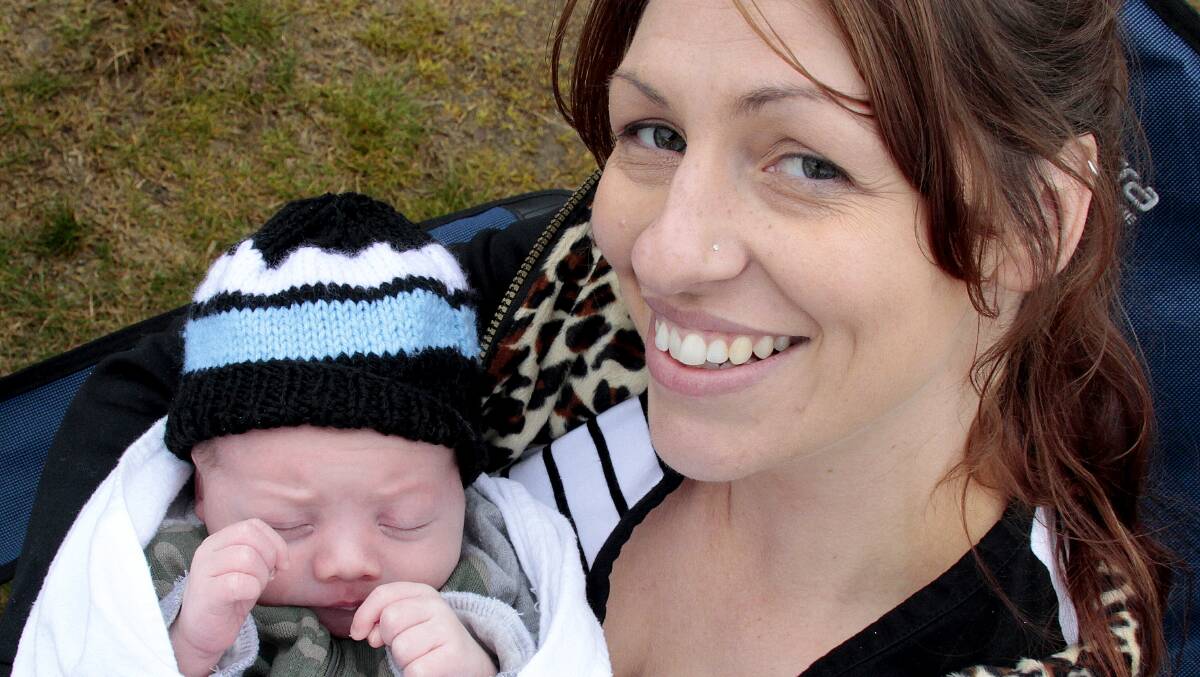 SLEEPING BEAUTY: At just two weeks old, Charlie Ricketts enjoys his first Strikers games with mum Janine at O'Connor Park last Sunday. Picture: Kelly Manwaring