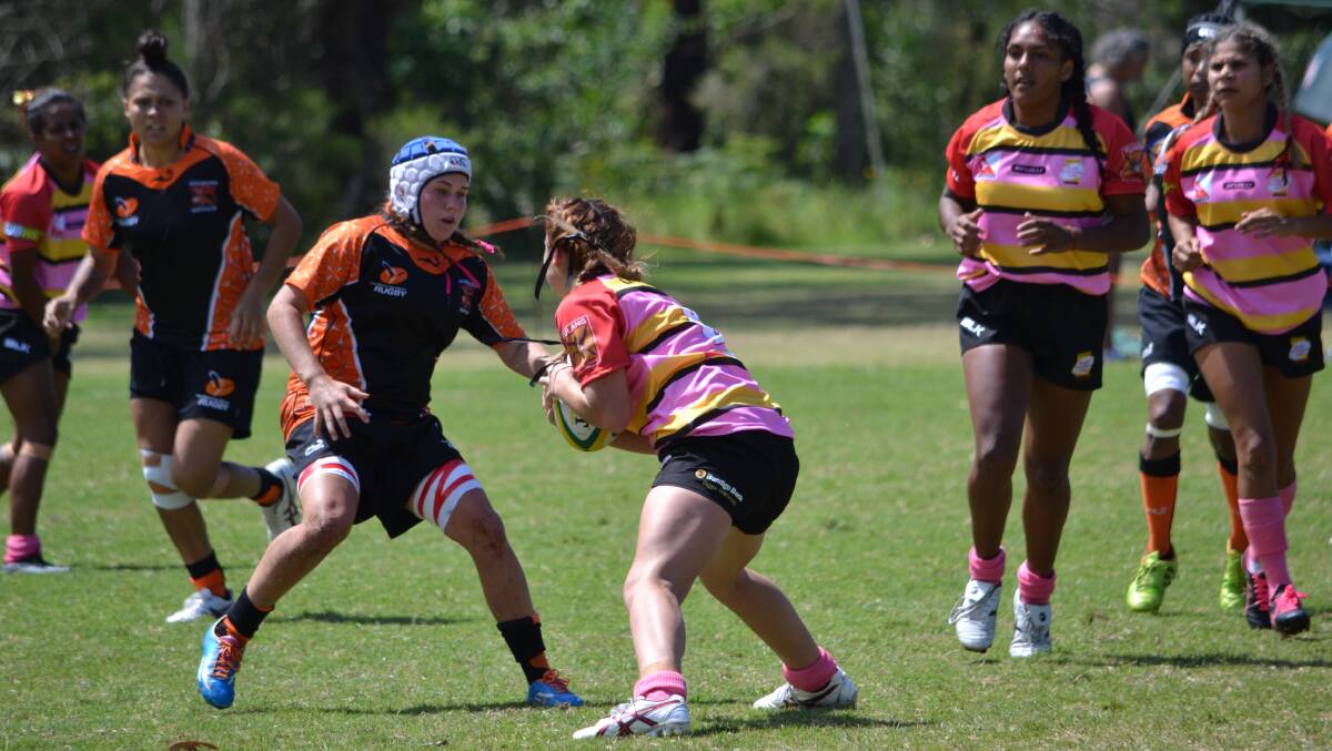 NEXT ROUND: Sammy Maxwell (blue and white headgear) in action for the Northern Territory earlier this year. She has made it through to the next round in selection the Australian youth girls rugby sevens squad. Picture: Chris Maxwell
