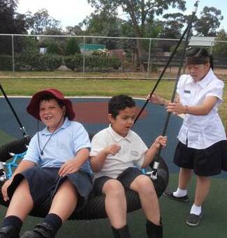 FUN WITH FRIENDS: Elouera Special School students testing out the newly-installed state of the art playground equipment. 