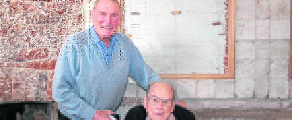 SAD PASSING: Allan Crowe with his lifelong buddie Ted O’Connor - taken last year observing the restoration of his old shop.