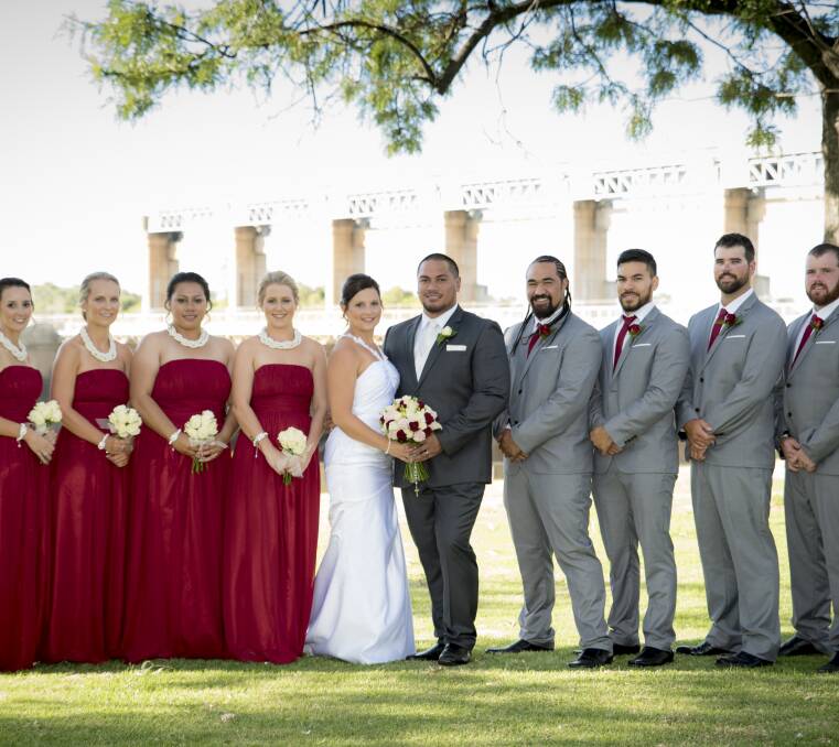 JUST GORGEOUS: The bridal party in the garden at the Golf Resort.