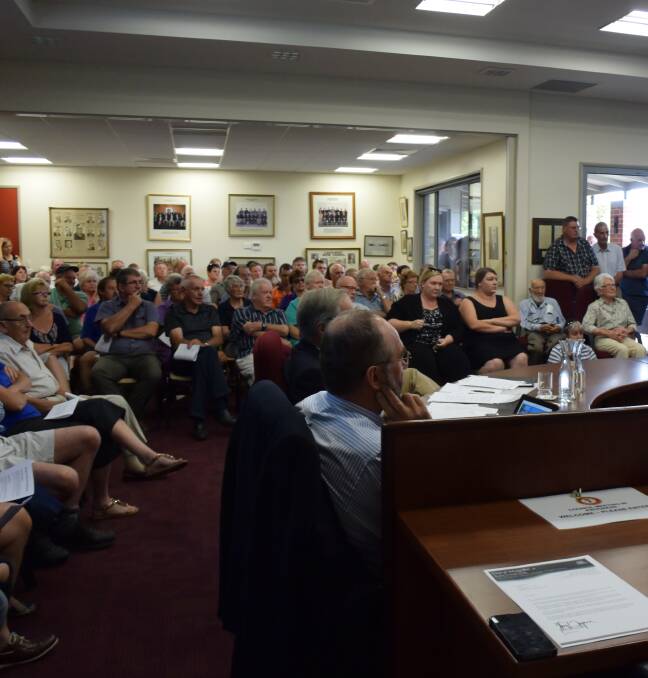 PASSIONATE: A packed house discusses council mergers at Lockhart recently. Residents across the state are furious about being forced to merge.