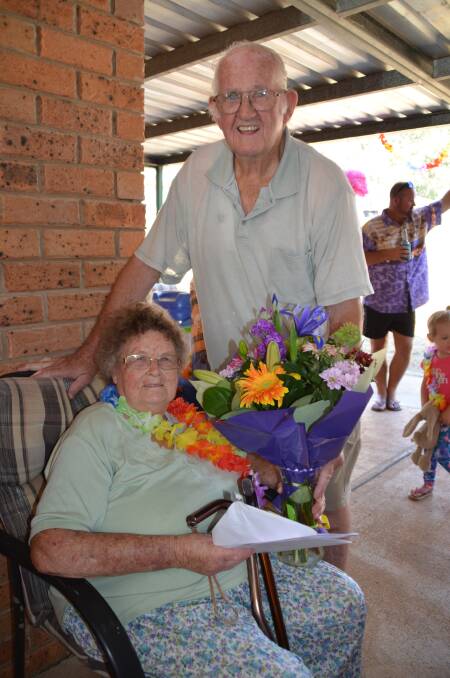 BIRTHDAY BUNCH: Gladys with husband Colin and his gift of flowers.