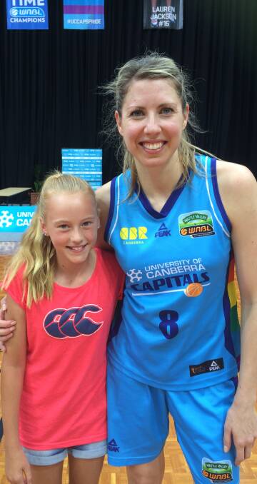 STAR: Cootamundra Cougars player Oddessa Treager was over the moon to meet Carly Wilson of Canberra Capitals at a game in Canberra last Sunday.