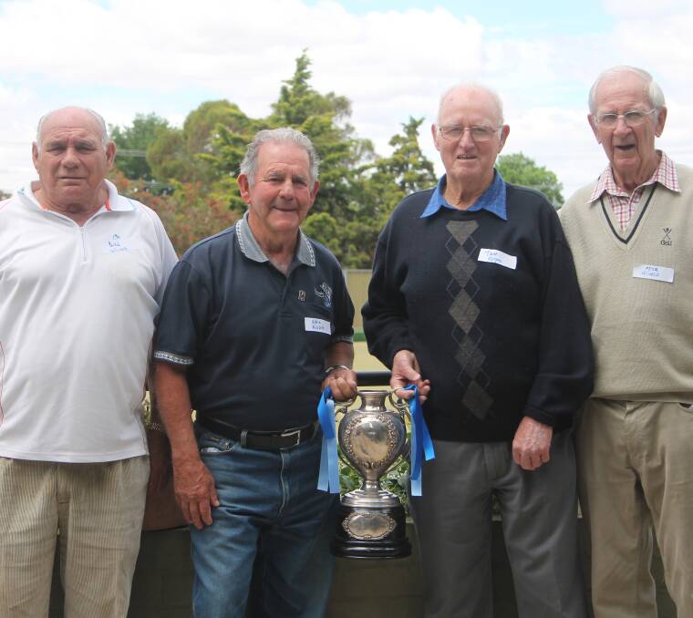 REUNION: Bill Woods, who played Maher Cup 1962-63, Eric Kuhn (1953-66), Tom Apps (1959-66) and Mick Howse (1947-55) with the Maher Cup in 2013.