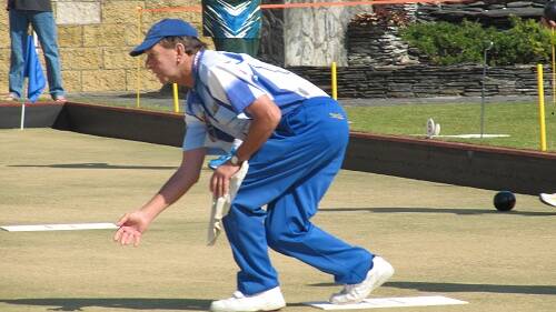 BOYS IN BLUE: Rob Hillier sends one down the green for Ex-Services Club recently. Picture: Contributed