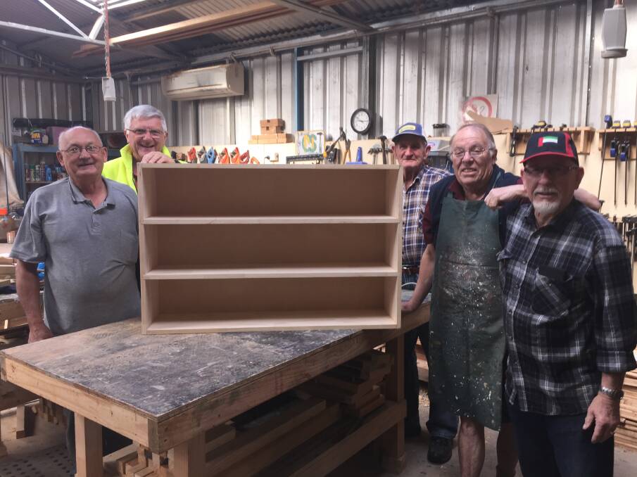 CREATING: Members of the Cootamundra Men’s Shed - Ken You, Phillip Breeze, Eddie Jarrott, Eric Hodgson and John Ashcroft with a shoe box they recently made.