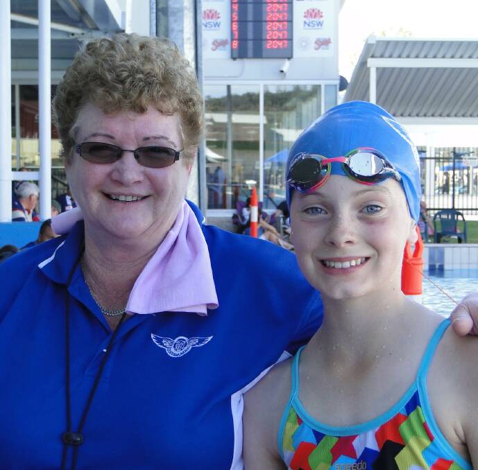 PLEASED: Coach Sue Parkinson with swimmer Maddie Brown. Maddie took 33 seconds of her 100m back stroke. Picture: Contributed