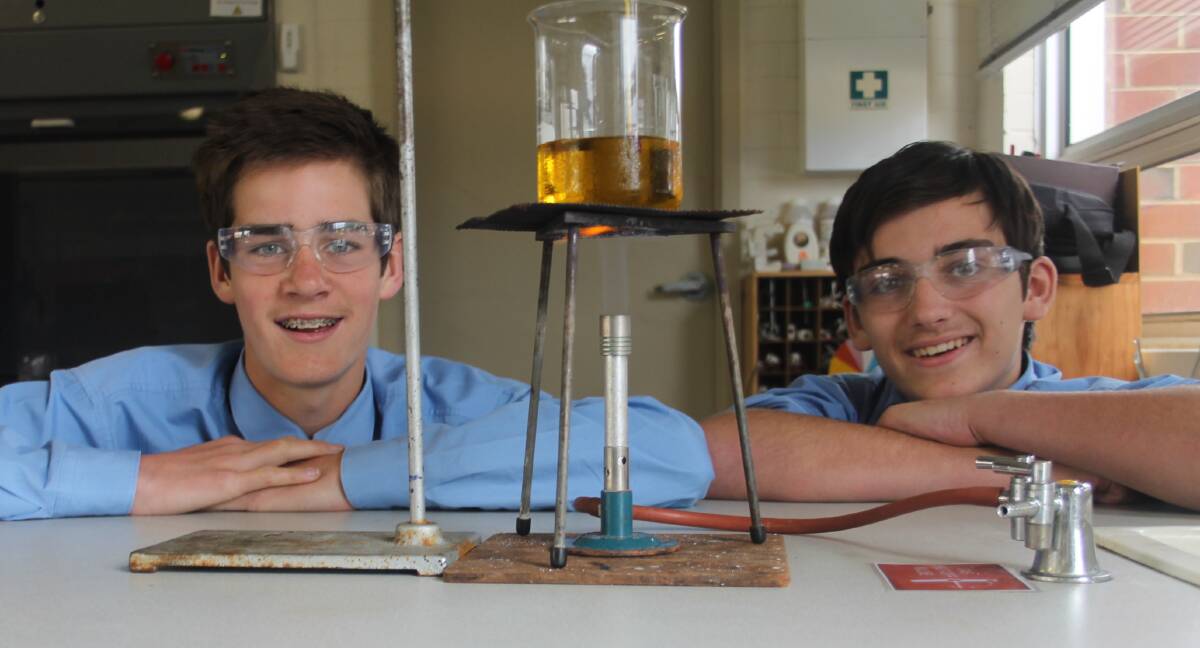 FUN TIMES: Sacred Heart Central School young scientists Ben Rumble and Angus Cowin in class this week. Picture: Jennette Lees 