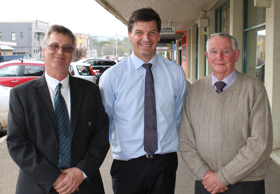 WATCHING ON: Angus Taylor congratulated Cootamundra Shire mayor Jim Slattery and general manager Ken Trethewey on the signing of a funding agreement for CCTV cameras in CBD businesses.