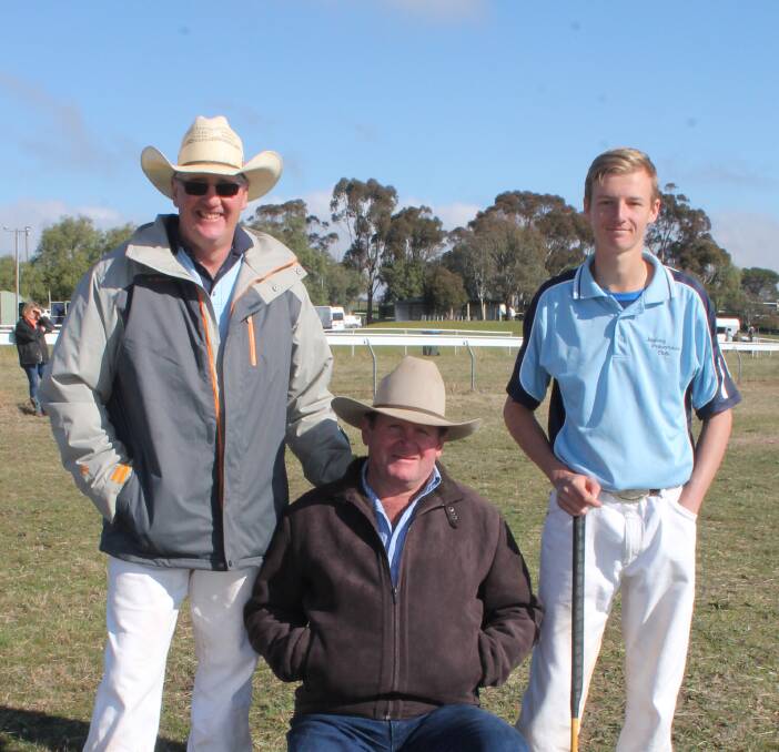 TAKING A BREATHER: Jugiong polocrosse players Rod and Trent Bourlet take a break from the on-field action with a top supporter of the club Brian White at the annual Harden Carnival on Saturday. Picture: Jennette Lees 