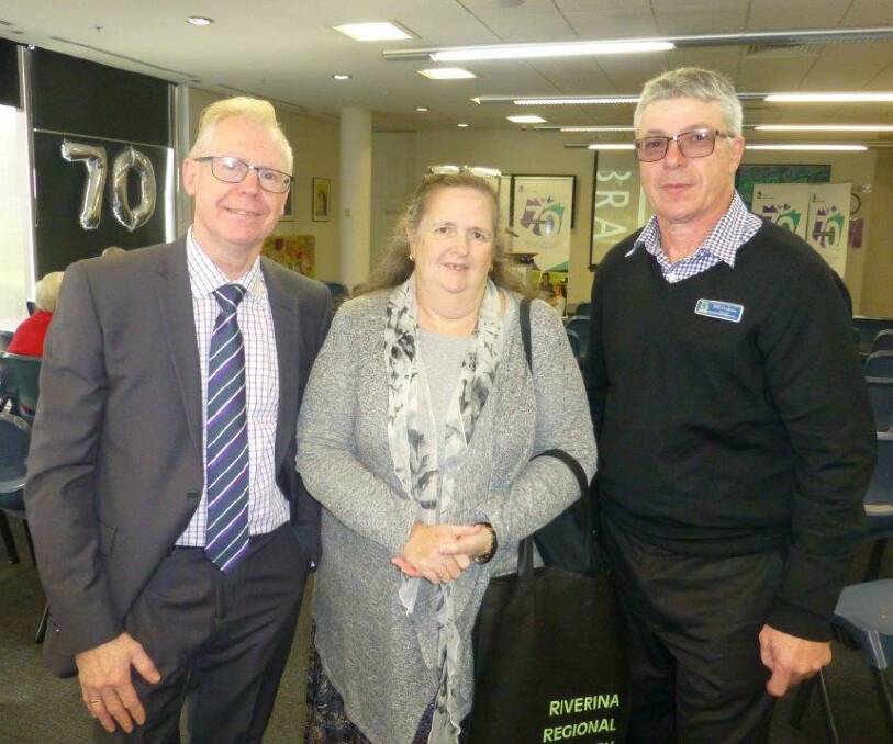 RECOGNITION: Councillor Dallas Tout, Reading Culture Award winner Sharon Smith  and Cootamundra Public Principal Bill Godman at Wagga City Library. Picture: Contributed 