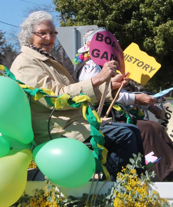 PARADE FUN: Dot Woodman of Cootamundra's University of the Third Age group gets into the Wattle Time theme during last year's well-supported street parade. Picture: Jennette Lees 