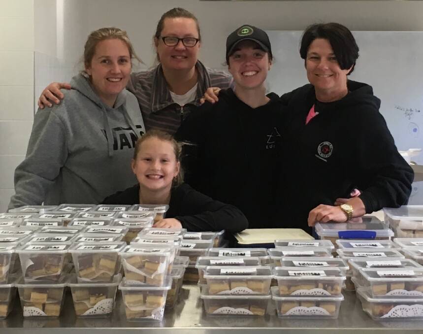 HOME CHEFS: Samantha O'Loughlin, Emma O'Loughlin, Ash Haines and Tisha McTavish with helper Brooke O'Loughlin with some of the slices whipped up for their fundraising efforts. Picture: Contributed. 