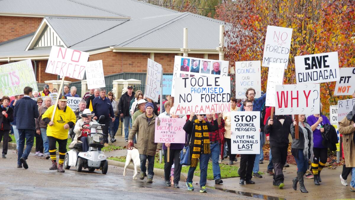 UP IN ARMS: Gundagai residents rallying prior to the merger announcement almost 12 months ago, are preparing an anniversary rally next Friday, May 12 from 12noon until 1pm in Carberry Park. Picture: Contributed 