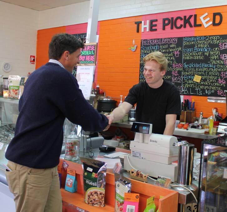 MEET AND GREET: Angus Taylor at the Pickled Pantry at with employee Sam Masters during a visit to Cootamundra on Monday. 