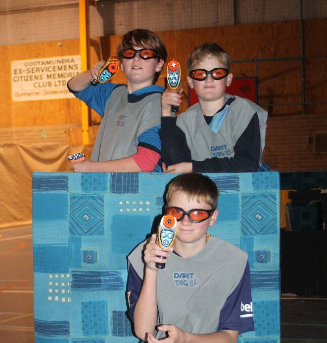 AIM AND FIRE: Ethan Campbell, Dylan Slaven and Liam Thompson get into a Nerf Wars battle at the Sports Stadium. Nerf Wars is back these holidays. Picture: Jennette Lees 