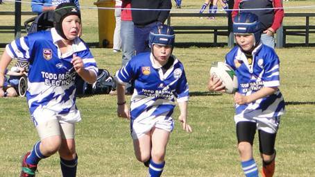 CARNIVAL FLASHBACK: Sam Bragg has the support of Lachie Sedgwick and Elliot Patterson playing under 9s at the Junee Carnival back in 2013. 
