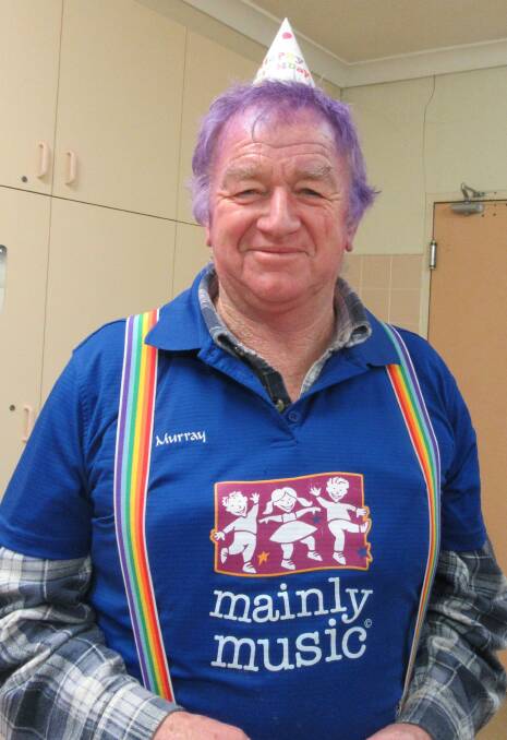 HAPPY OCCASION: Cootamundra's Murray Billsborrow sports purple hair and a party hat for the Mainly Music first birthday celebration. Picture: Contributed 