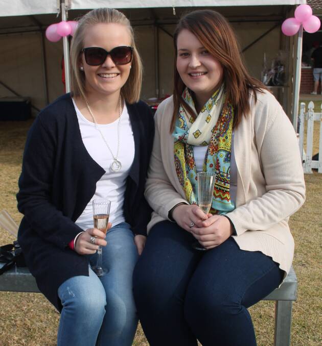 ENJOYING THE ACTION: Cootamundra Rugby Club supporters Maddi Sutherland and Brooke Smith during the 2015 Ladies Day at Country Club Oval. 