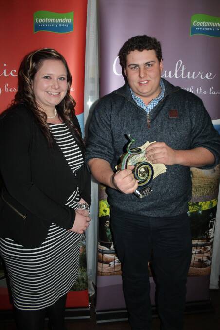 The CDC's Ashleigh Warton congratulates Will Fitzgerald, of Spinifex Welding, on his Apprentice of the Year Award at last year's Business Awards. Picture: Jennette Lees 