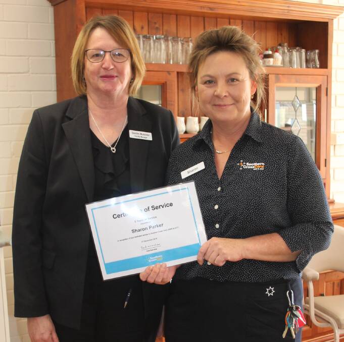 CONGRATULATIONS: Southern Cross Care Retirement Village facility manager Deirdre McAlister with Sharon Parker, who has notched up five years. Picture: Jennette Lees 