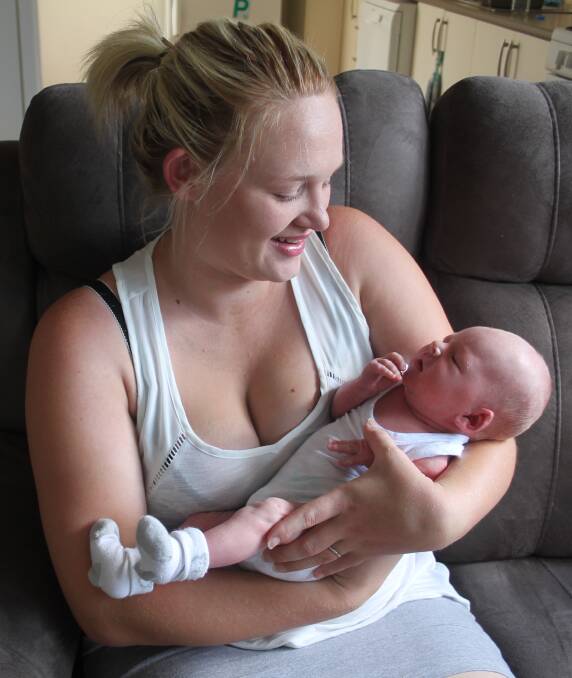 MOTHERLY LOVE: Cody Doyle, with his mother Kate Jennings, was the first baby born at Cootamundra Hospital this year, arriving on January 8. Picture: Jennette Lees 