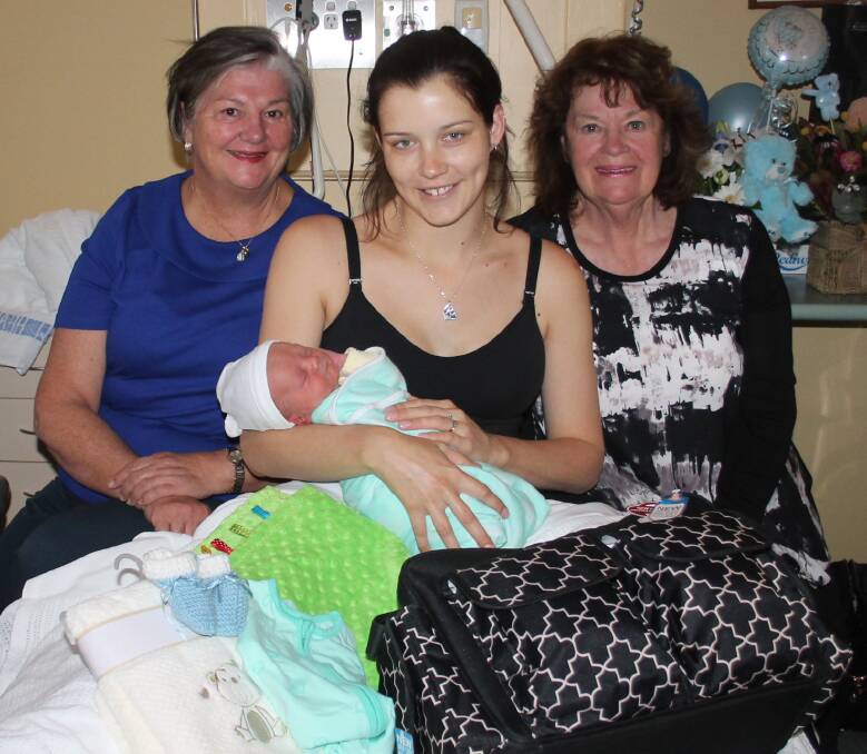 PRECIOUS: As per tradition, CWA treasurer Ellen Ingold and president Gloria Schultz present Karin Rogers and baby Bentley with a gift for being the baby born at the Cootamundra Hospital closest to Mother's Day. Picture: Jennette Lees 