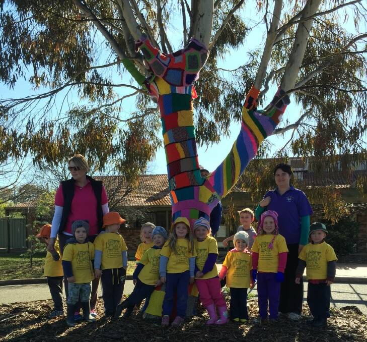 CHECK IT OUT: Little Wattle Preschoolers were thrilled to see the yarn-bombed tree at the Cootamundra Nursing Home during a recent excursion.