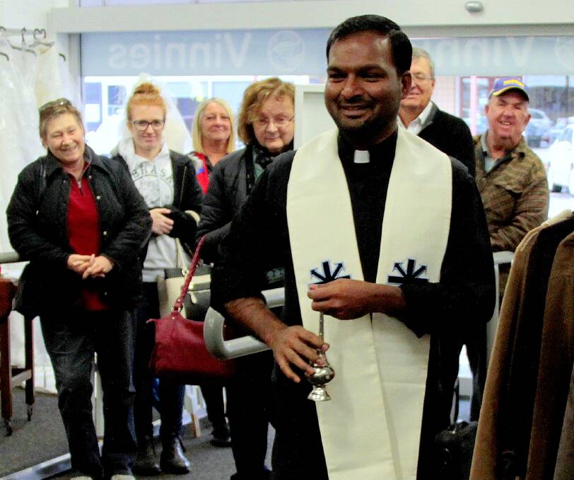 BLESSING: Father Joshy Kurian from the Sacred Heart Parish was on hand on Saturday to officially open and bless the new Vinnies store. Picture: Kelly Manwaring  