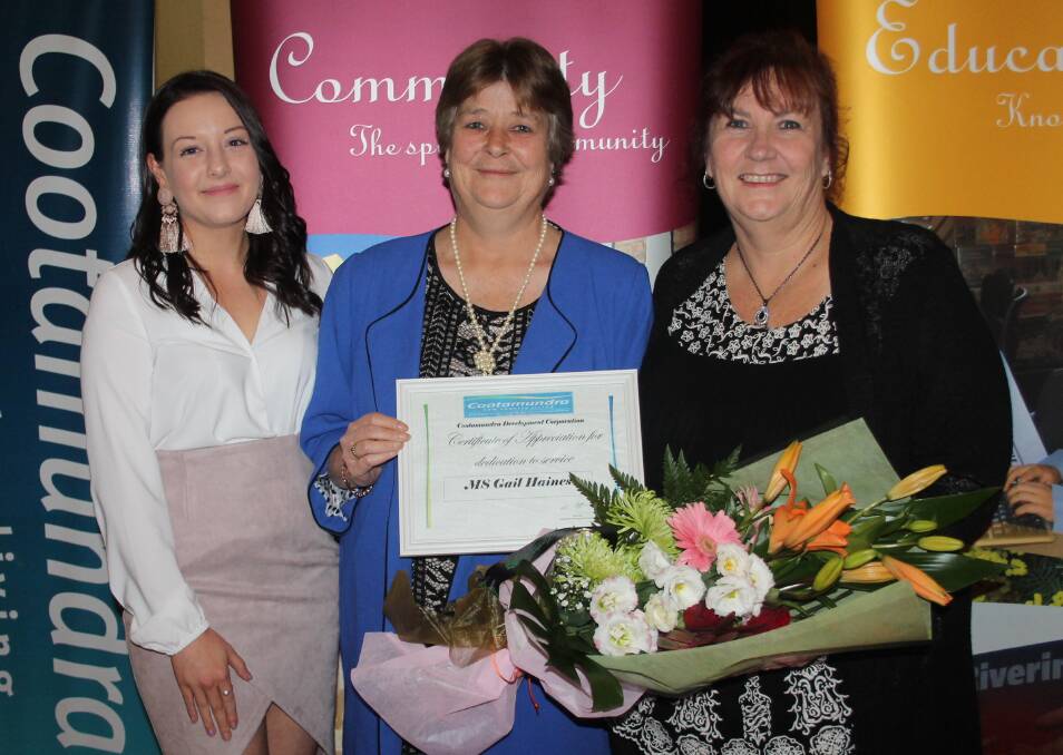 LEAVING: Gail Haines (centre) is congratulated for her 11-year long contribution to the CDC by current and former office managers Kate Collingridge and Sharon Breese. Picture: Jennette Lees 