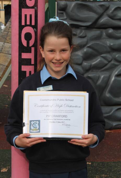 WELL DONE: Cootamundra Public School captain Pip Crawford with her certificate for achieving 100 merit certificates. Picture: Jennette Lees 