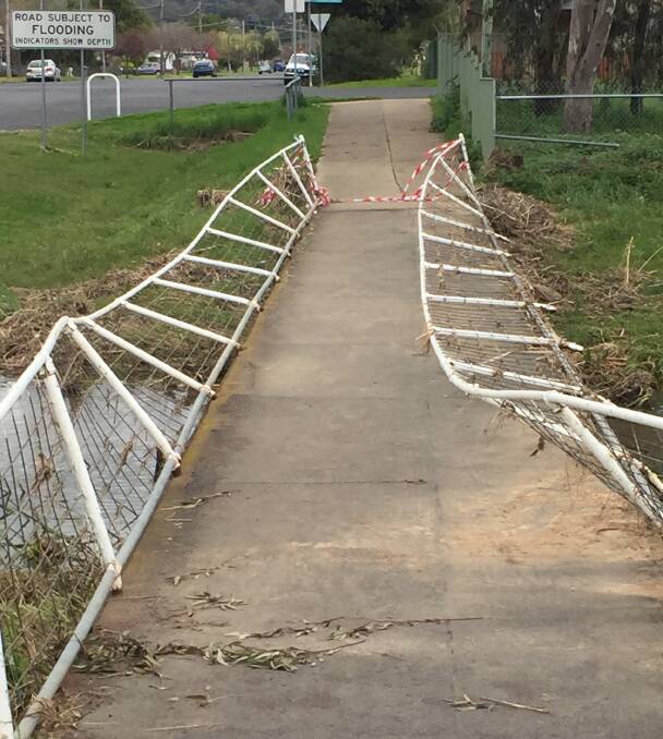 DAMAGE UNKNOWN: While it is clear the Thompson Street footbridge handrails will need replacing the extent of any structural damage is not yet known. Picture: J Lees 