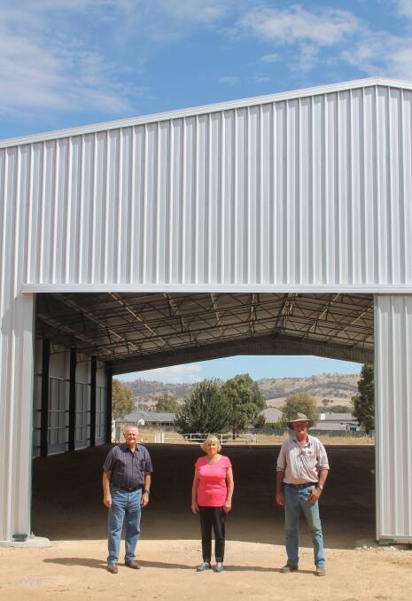 SHOW ASSET: Cootamundra Show Society members Geoff Larsen and David Manwaring with council administrator Christine Ferguson outside the new building. Picture: Jennette Lees 