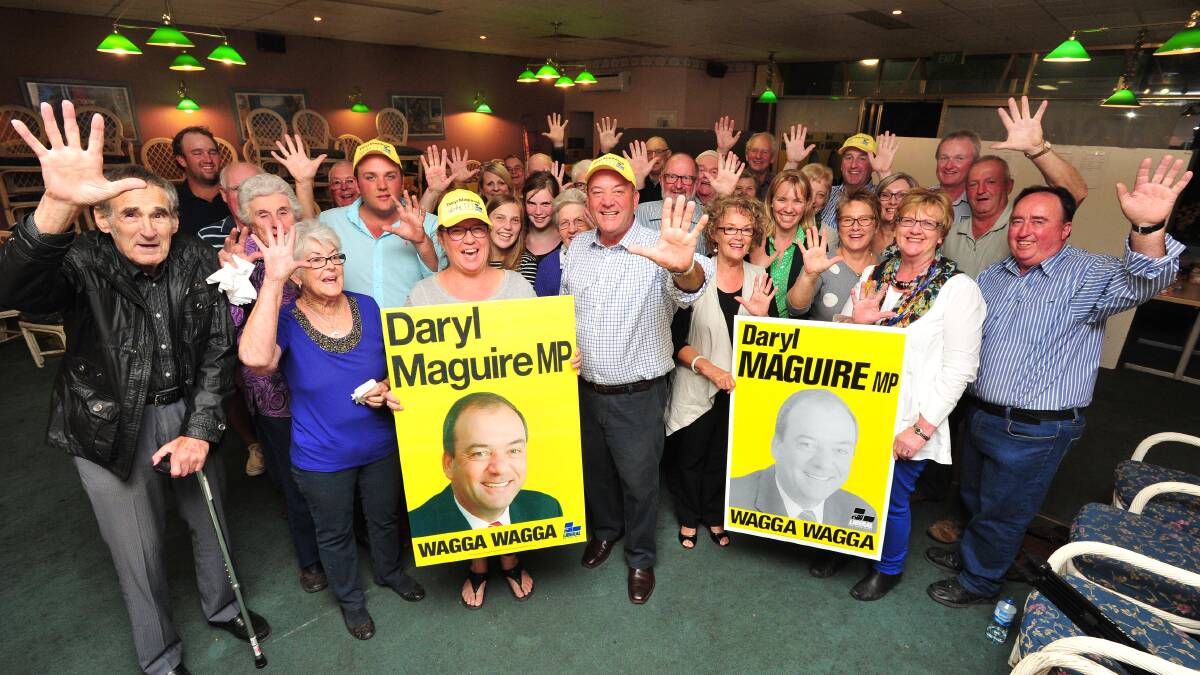 VICTORY: Re-elected Wagga MP Daryl Maguire celebrates his win with supporters at his campaign office. Picture: Kieren L Tilly