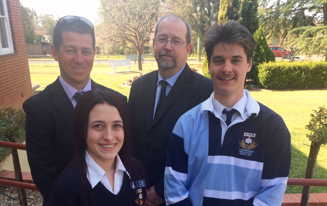 Former year advisor Brendan Gale and principal Neil Reaper with outgoing school captains Tahlia Gatto and Lorcan Elleman after the graduation assembly.