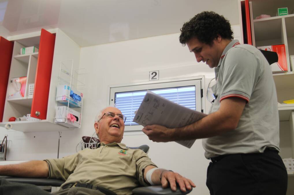 THE JOY OF GIVING: Cootamundra resident Alan Thompson shares a laugh with the Red Cross crew during his 122nd donation. Picture: L Grey