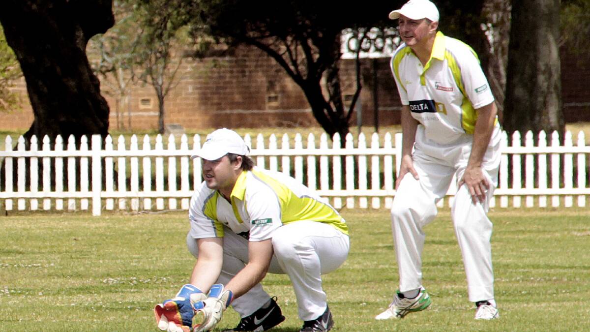 FOCUS: Matt Berkrey (left) behind the stumps before adding 29 runs with the willow. Picture: Kelly Manwaring