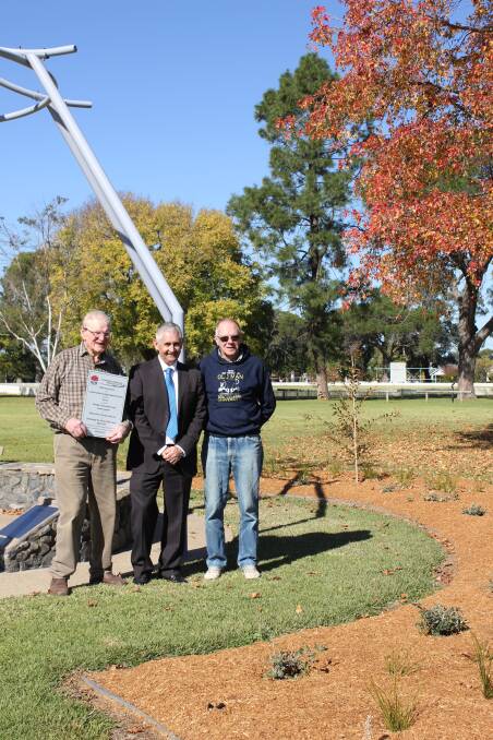 FUNDED: Administrator Stephen Sykes presents a plaque to Rotarians Hugh Hamilton and Neil Wilcox at the Peace Pavilion. Picture: CGRC. 