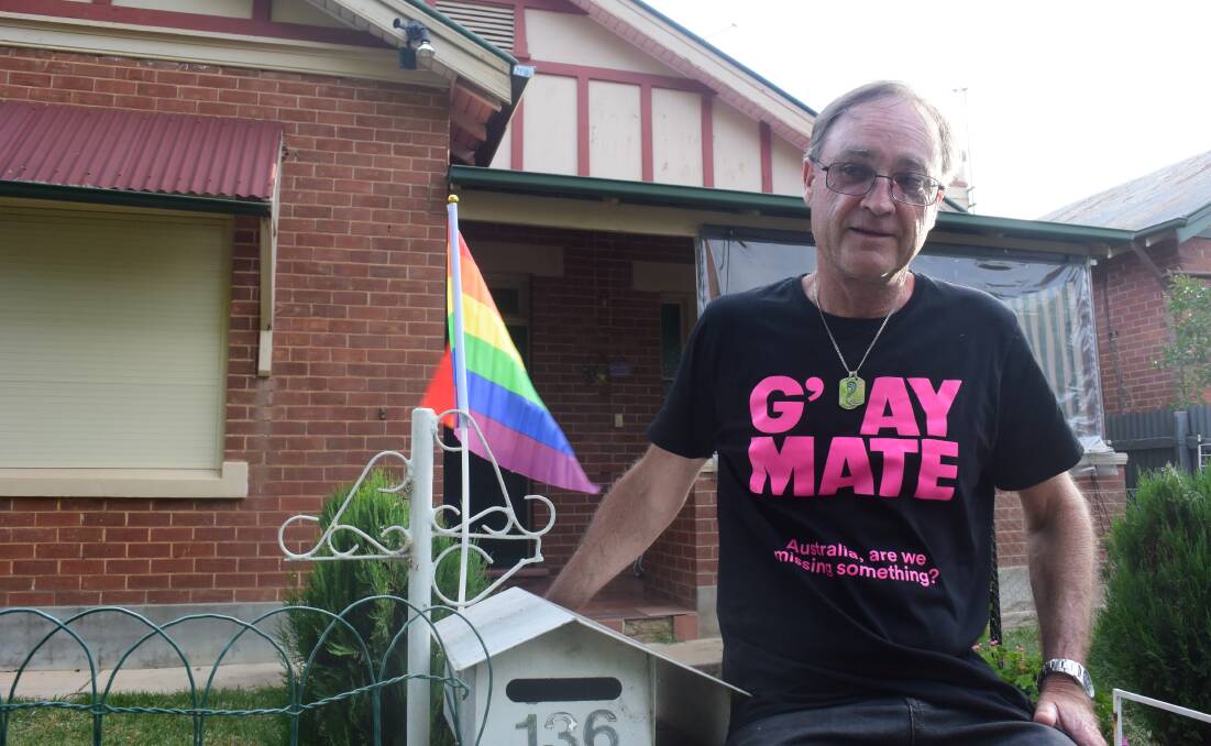 PRIDE: Glenn Miller celebrates the postal survey result in Wagga on Wednesday evening. Picture: Lachlan Grey