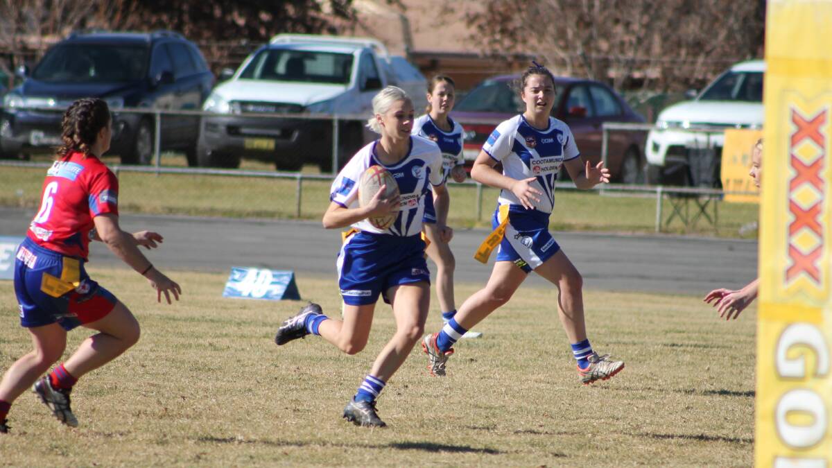 CHARGE TO THE FINALS: Bullettes try-machine Renae Glanville (centre) will shape up for Cootamundra in this weekend's pivotal clash with third-placed Brothers Wagga. Picture: Jennette Lees