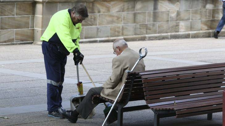 Taking out the rubbish. Roger Rogerson observes a new broom outside Sydney's Supreme Court.  Photo: Peter Rae