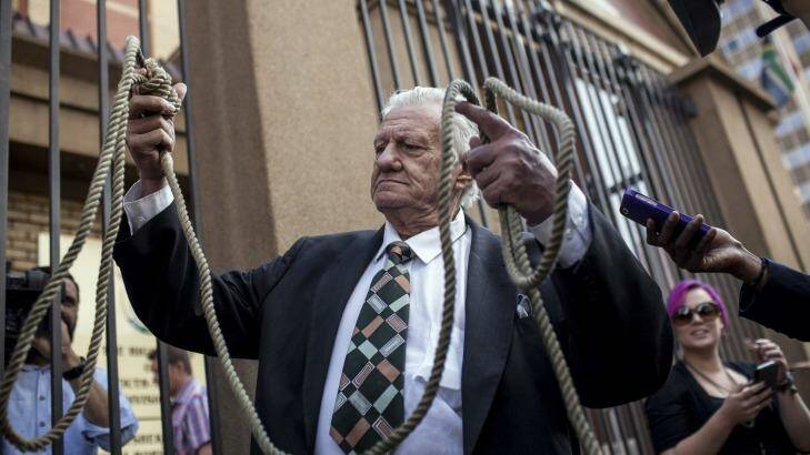 A man that called himself 'Mr Noose' who wants to see justice to crimes against women arrives at North Gauteng High Court. Photo: Charlie Shoemaker/Getty Images